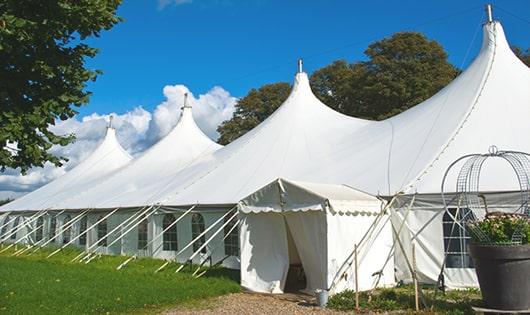 a line of sleek and modern portable restrooms ready for use at an upscale corporate event in Bunnell